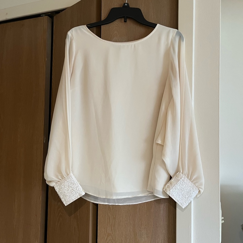 Jennifer Lopez Slit Sleeve Top